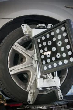 Detail of wheel alignment machine tool mounted on a wheel Stock Photos