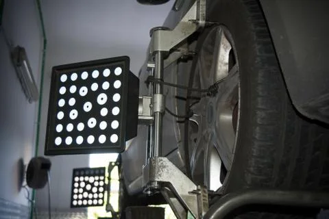 Detail of wheel alignment machine tool mounted on a wheel Stock Photos