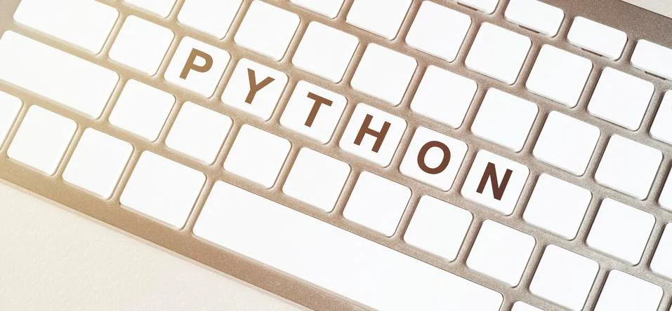 Detail of white keyboard with the word PYTHON on the space bar. concept of sm 写真素材