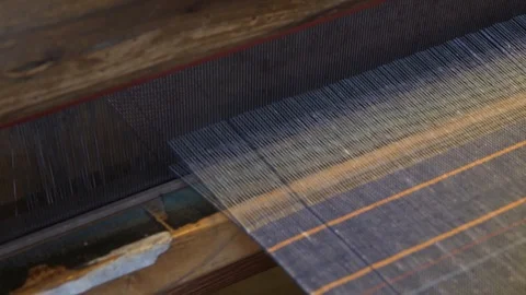 Detail of the work on a textile loom Stock-Footage 125948595
