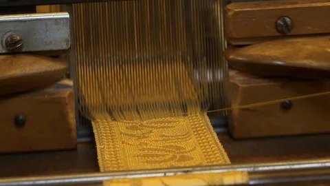 Detail of the work on a textile loom Stock Footage 126211173