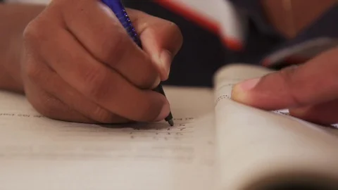Detail Of Young Student Black Hands Writing On Exercise Book Stock Footage