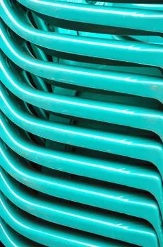 Detaild of pattern stacks green plastic chairs Stock Photos