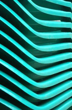 Detaild of pattern stacks green plastic chairs Fotos de archivo