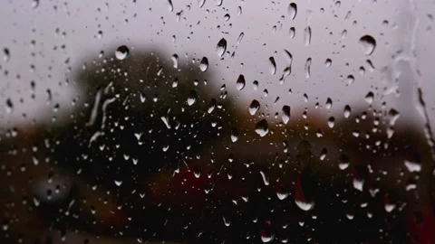 Detaile close up of heavy rain tiny water drops streaming down on glass window 動画素材 163186260