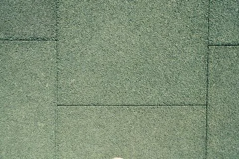 Detailed abstract background of soft shock-absorbing green EPDM rubber crumb Stock Photos