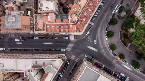 A Detailed Aerial View Of Intersecting Streets And Terracotta Rooftops In A Stock Footage 297723810
