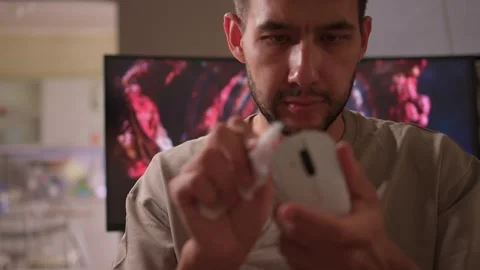 A Detailed and Close Up Guide for Effectively Cleaning Your Computer Mouse Stock Footage 315140509