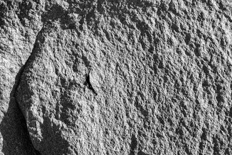 Detailed background texture of a rough grey stone rock surface 스톡 사진