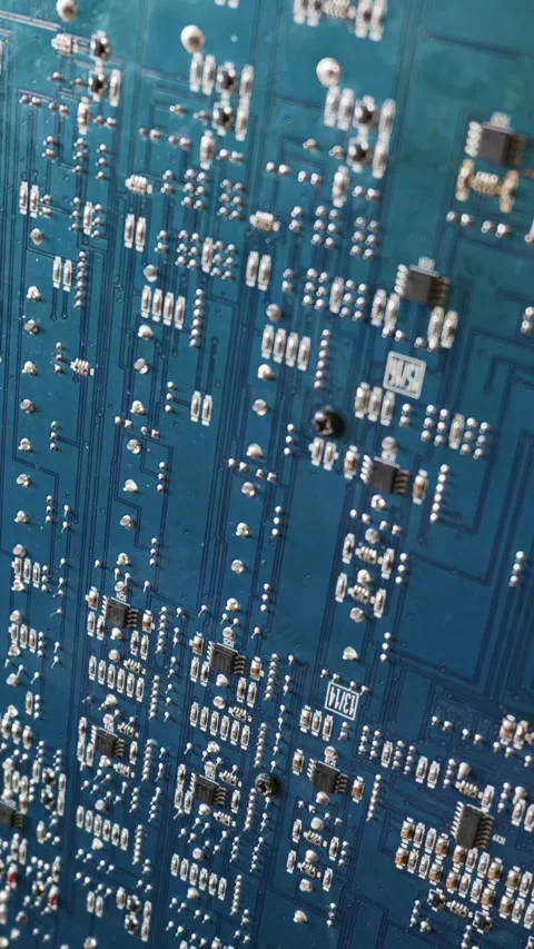 Detailed Blue Printed Circuit Board Covered with Solder Joints and Microchips Stock Footage 333819633