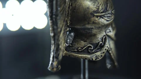 Detailed bronze helmet spin, gladiator armor macro, studio lighting and Stock Footage 334135922