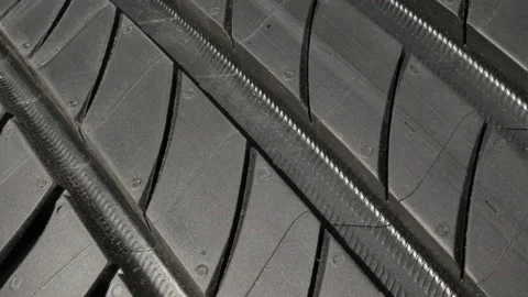 Detailed car tyre tread pattern 4K tilting video Stock Footage 90038540