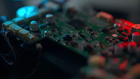 Detailed close-up of a circuit board highlighting electronic components and Stock Footage 295895089