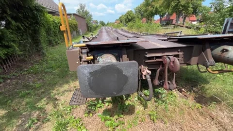Detailed close-up of the coupling system, buffers and technical hardware on a fr Stock Footage 340809427