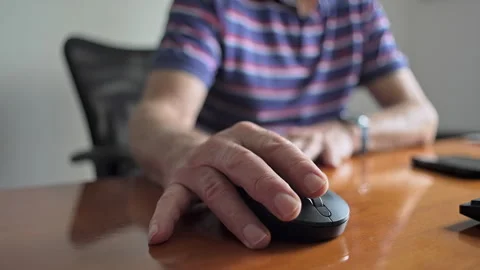 Detailed Close-Up Of Elderly Mans Hand Guiding Mouse Over Wooden Surface Du.. Stock Footage 320959852