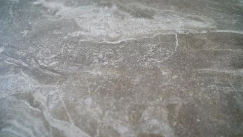 Detailed close up of grey stone texture with natural white veins and a roug.. Stock Photos
