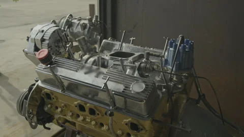 Detailed close-up of a high-performance chrome car engine Vídeo Stock 335732304