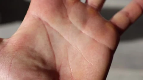 A detailed close-up of a human palm, showcasing intricate skin texture, fine lin Stock Footage 304623315