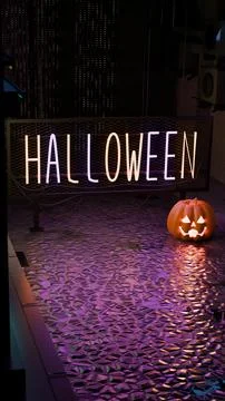 Detailed close up of Jack-o'-lantern and neon sign in golden volumetric haze Stock Illustration