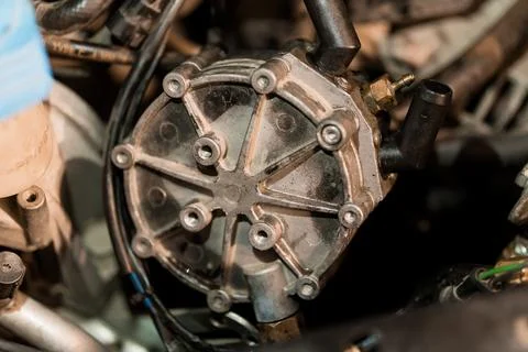 Detailed Close-Up of a Mechanical Engine Component in Automotive Setting Stock Photos