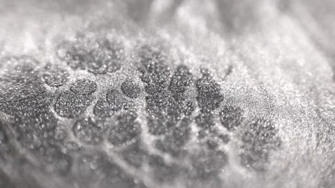 Detailed close-up of silver titanium paint with specialized sandy texture Stock Footage 327605454