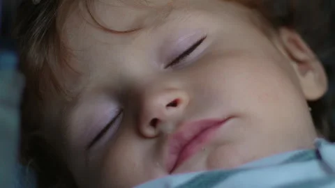Detailed close up of sleeping toddler during stroller nap capturing softnes.. Stock Footage 342828085