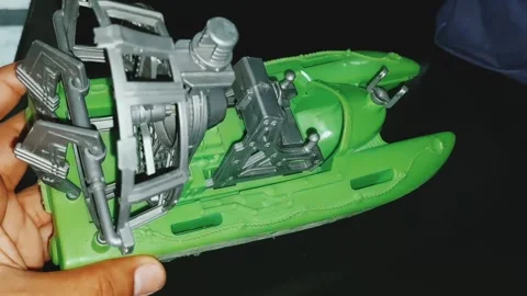 Detailed Close Up View Of A Green Plastic Toy Airboat Stock Footage 333611604
