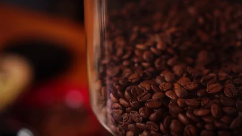 Detailed close up view on pile of robusta arabica coffee beans in coffee grinder Stock Footage 104372707
