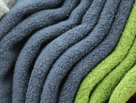 Detailed close up view on samples of cloth and fabrics in different colors .. Stock Photos