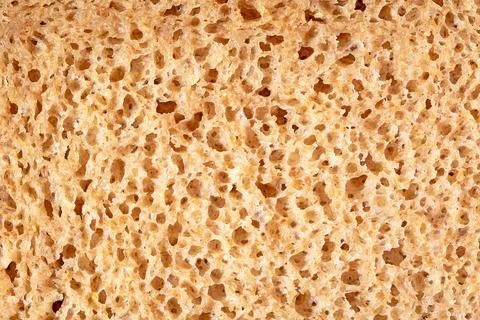 Detailed close-up view of sliced bread texture, freshly baked wheat loaf su.. Stock Photos