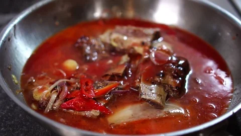 Detailed close up view on vegetable mix and meat pork ribs mixed with hot tomato Stock Footage 106813319