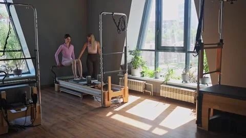 A detailed closeup of a foot work and core exercise on Body Reformer machine Stock Footage 346285821