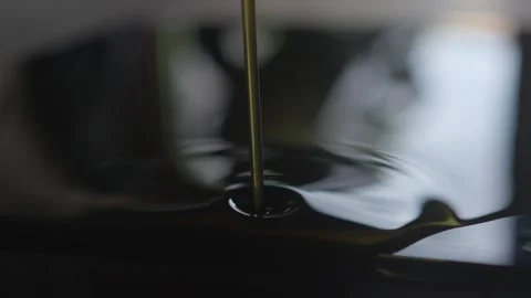 This is a detailed closeup image showcasing the beautiful liquid flow of pouring Stock Footage 313283420