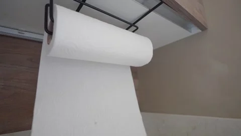 A Detailed CloseUp Perspective of a Kitchen Paper Towel Roll Stock Footage 297731048