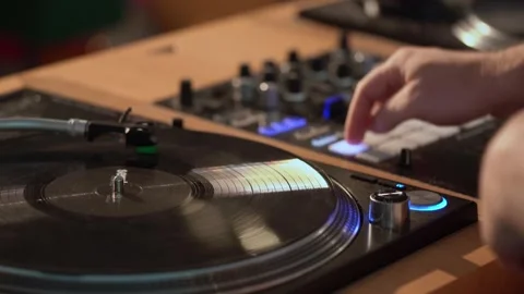 A Detailed CloseUp of a Turntable Actively Playing a Vinyl Record for Music Video stock 314576794