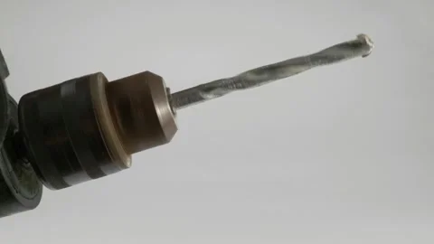 This is a detailed closeup view of a Drill Bit that is currently in action Stock-Footage 312947801