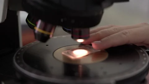 A Detailed CloseUp View of a Microscope Actively Being Used for Scientific Stock Footage 300489395