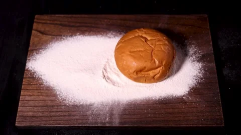 A detailed closeup view of white granular substance scattered on a wooden board Stock Footage 279058166