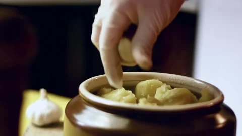 Detailed creamy mashed potatoes served from a rustic clay pot in top view, 4K Stock Footage 341103466