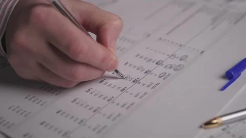 Detailed Examination Of Sheets For Discrepancies And Accuracy Checks, Meticulous Stock Footage 323923950