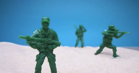 Detailed extreme close-up. set of toy soldiers in the sand Stock Footage
