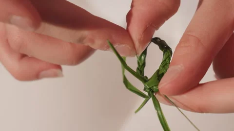 Detailed fingers weave subtle loop. Focus on fingers creating heirloom symbol Video stock 330429416