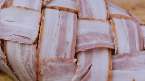 Detailed finished dish: rolling pork tenderloin into a compact roast Stock Footage 342184797