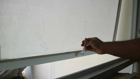 Detailed footage capturing a persons hand lifting and opening frosted glass.. Stock Footage 332199279