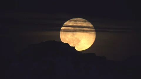 Detailed full moon rising over mountain clouds Iceland time lapse Stock Footage 128777960