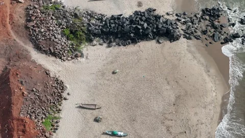 A detailed, high-angle drone video captures the meeting point of a river and Stock Footage 315128629