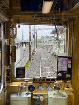 Detailed Inside View of a Train Cab Showing the Control Panel and Tracks in Stock Photos