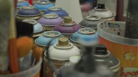 A detailed look at an array of vibrant aerosol cans used for professional Stock-Footage 335964123