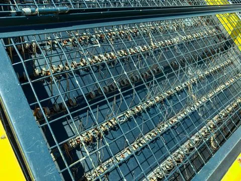 A detailed look at a wire mesh grid with multiple rows of coils, set against  Stock Photos