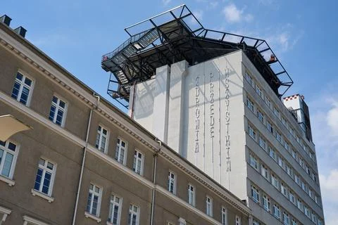 Detailed low angle view of Saint Vincent de Paul Hospital facade with vertica Stock Photos